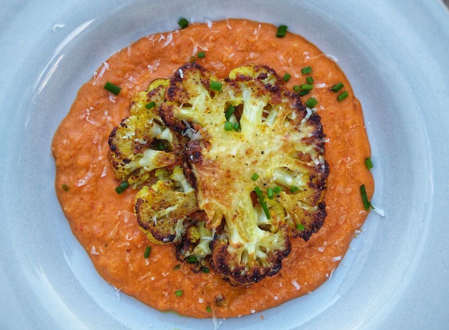 Cauliflower steaks with roasted red pepper sauce